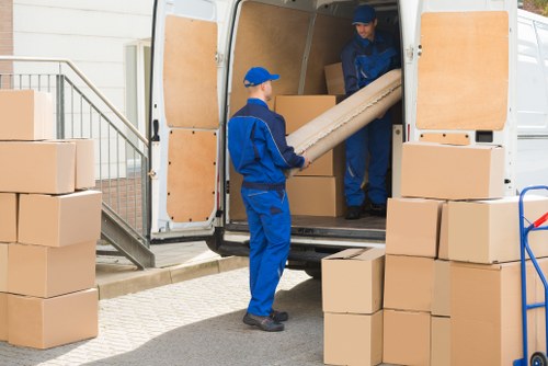 Local man and van moving boxes in Battersea near residential flats