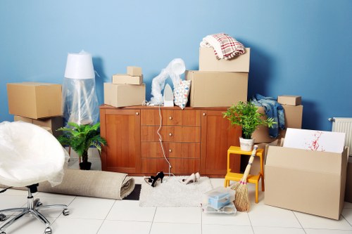 Removal van loading furniture outside a Battersea flat