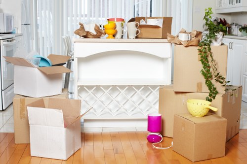 Furniture being carried from a Battersea flat during a removal