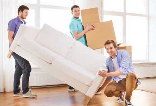 Moving van and packed boxes in a Battersea street