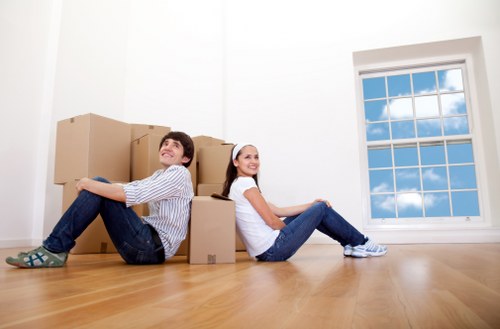 Removal crew loading boxes and furniture for a Battersea move