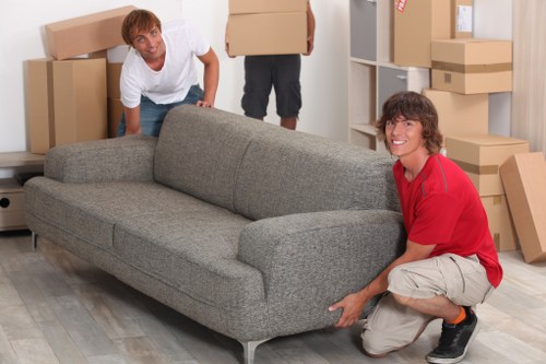 Professional movers loading furniture for a Battersea removals service