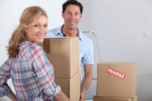 Packed office boxes and furniture ready for relocation in Battersea