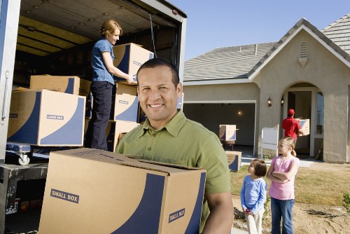 Unpacking service helping a family settle into a Battersea property